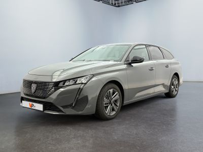 a grey car is parked in a white room with a black floor