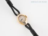 an image of a wrist watch on a black leather strap