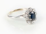an oval sapphire and diamond cluster ring in white gold