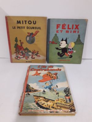 trois livres pour enfants sont posés sur une table les uns à côté des autres