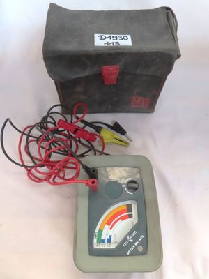 a box with wires and a meter on a table