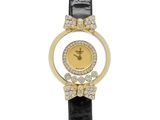 a lady ' s wrist watch with a black leather strap and a gold plated case