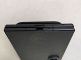 a close up of the back of a black cell phone