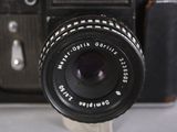 a close up of a camera with a lens attached to it