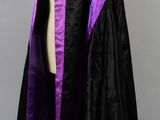a black and purple cloak on a mannequin mannequin