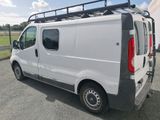 a white van that is parked in the parking lot