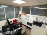 an image of an office cubicle with a lot of desk space