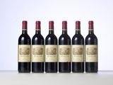 six bottles of red wine lined up in a row