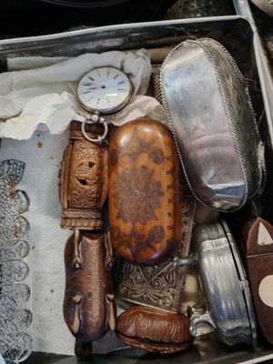 a metal box with a bunch of different items in it