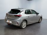 an image of a silver car in a showroom