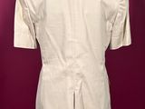 the back view of a beige shirt on a mannequin mannequin mannequin mannequin mannequin mannequin mannequin manne
