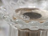 a close up of a glass vase on a table