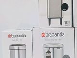 three boxes of brabantia trash cans stacked on top of each other