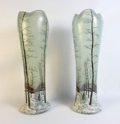 two vases that have been decorated with trees on them