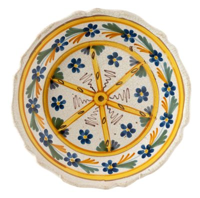 a yellow and blue plate with blue flowers on it