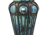 a vase that has a blue and green design on it