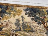 a tapestry with a picture of a landscape on it