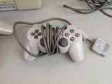 a video game controller hooked up to a charger