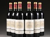 six bottles of wine are lined up in a row