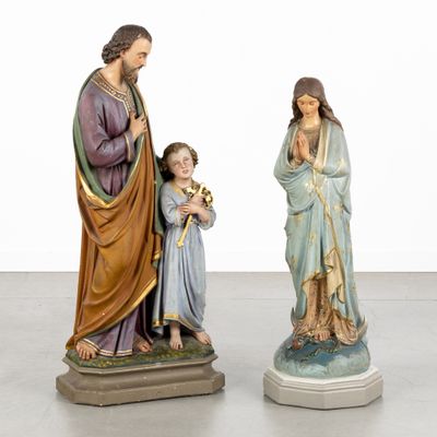 two figurines of jesus and mary with a child