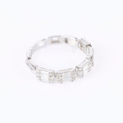 a close up of a diamond ring on a white background