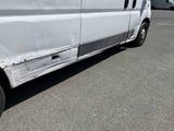 a white van that is parked in a parking lot