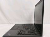 a close up of a laptop computer on a white surface