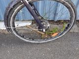 a bike that is parked in front of a building