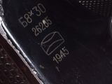 a close up of a metal object with writing on it