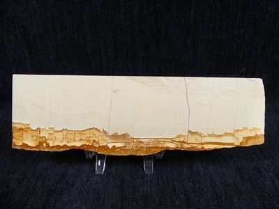 a close up of a piece of wood on a black background