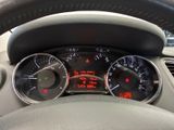 a close up of a car dashboard with various gauges