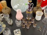 a table with a lot of glass items on it