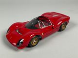 the toy car is red and has gold rims on it