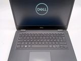 the dell laptop is open and ready to be used