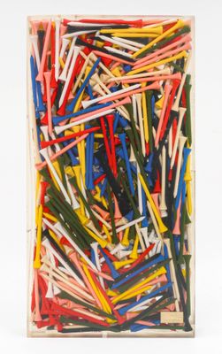 a close up of a box of assorted golf tees