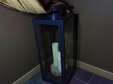 a candle that is sitting in a glass lantern