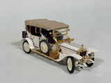 a model of an old car on a white surface