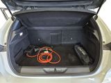 a trunk of a car with an electric charger in it