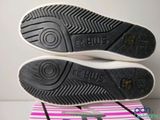a pair of shoes that are on top of a box