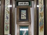 four framed pictures hanging on the wall of a room