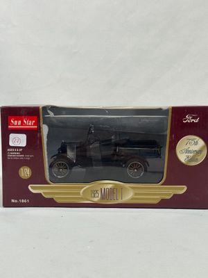 an old model car is in a box on a white surface
