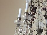 a chandelier with a bunch of crystal beads hanging from it