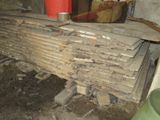 a pile of wood sitting on the floor in a room