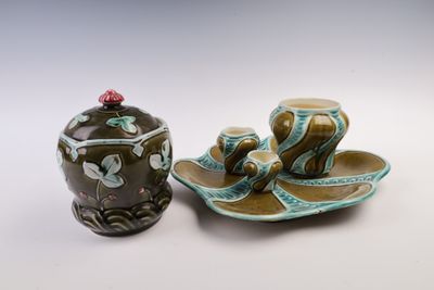 two small vases sitting next to each other on a table