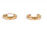 a pair of gold hoop earrings on a white background