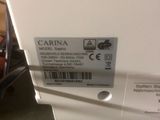 une photo d'un réfrigérateur blanc sur lequel est collée une étiquette
