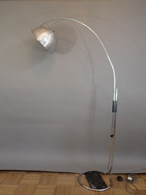 a lamp that is sitting on the floor next to a keyboard