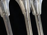 three spoons that are sitting next to each other
