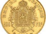 a gold coin with a coat of arms and a crown on it