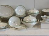 a lot of plates and bowls on a table